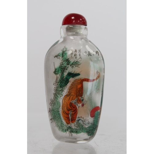 244 - Chinese glass snuff bottle of flattened ovoid form internally decorated with figures of two tigers a... 