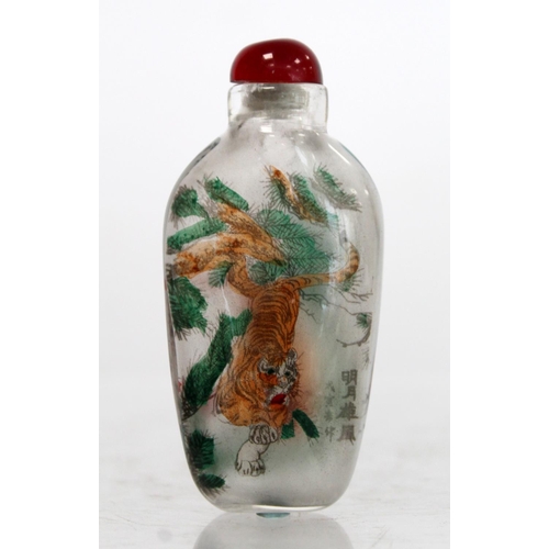 244 - Chinese glass snuff bottle of flattened ovoid form internally decorated with figures of two tigers a... 