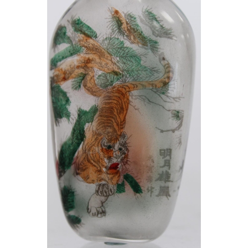 244 - Chinese glass snuff bottle of flattened ovoid form internally decorated with figures of two tigers a... 