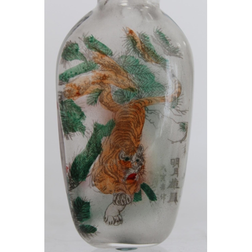 244 - Chinese glass snuff bottle of flattened ovoid form internally decorated with figures of two tigers a... 