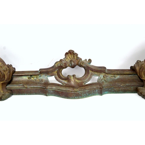 247 - Cast metal adjustable fender in three parts, the central rail with pierced scroll and shell, with fo... 