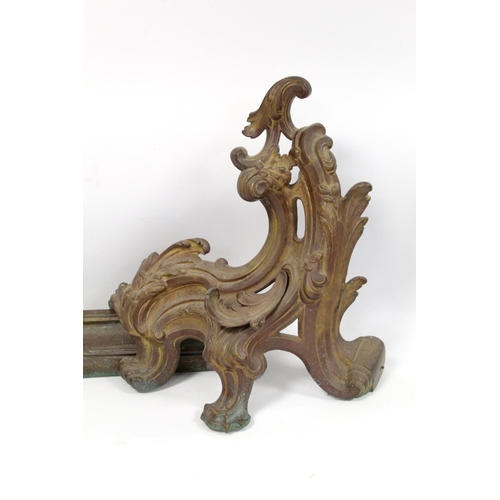 247 - Cast metal adjustable fender in three parts, the central rail with pierced scroll and shell, with fo... 