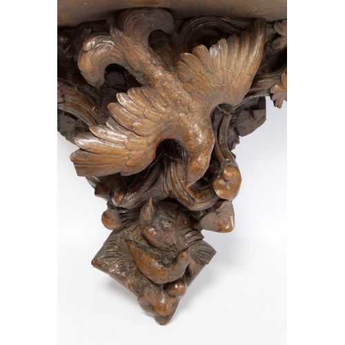 248 - Pair of Victorian or Edwardian walnut wall brackets, the demi lune tops on tapered supports profusel... 