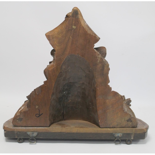 248 - Pair of Victorian or Edwardian walnut wall brackets, the demi lune tops on tapered supports profusel... 