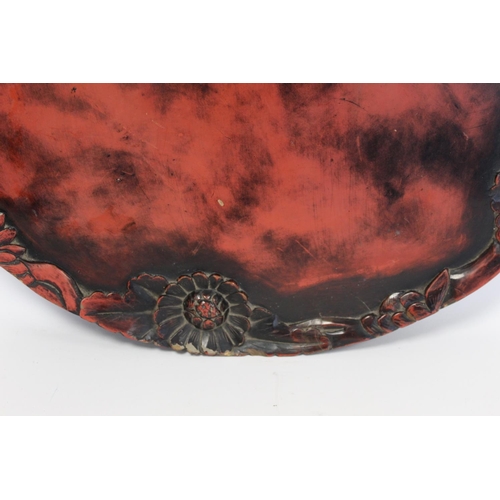 249 - Late 19th/early 20th century Japanese mottled red and black lacquer tray of large twin handled circu... 