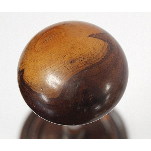 251 - 19th century treen wig stand, possibly yew or fruitwood, the domed circular top on tapered knopped b... 