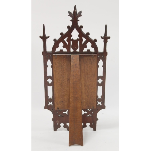 254 - Victorian small dressing table mirror, the rectangular glass in pierced and carved walnut gothic fra... 