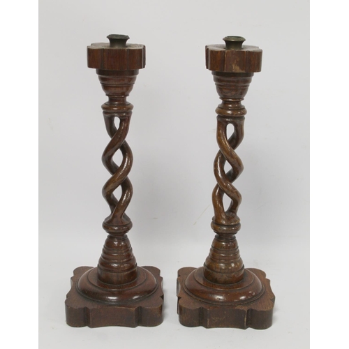 255 - Treen pokerwork candlestick with baluster column, domed circular foot and floral decoration, 25cm hi... 