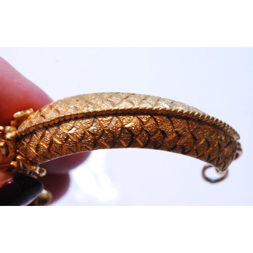 101 - Chinese gold bracelet in two halves, modelled as dragons grasping a ring, Chinese character and othe... 