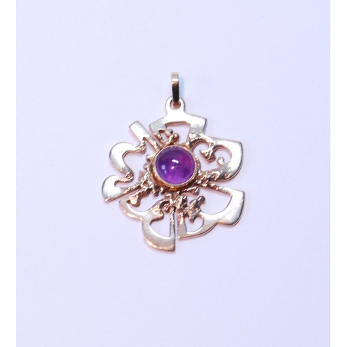 111 - 9ct gold openwork pendant with cabochon amethyst, 16.2g gross.