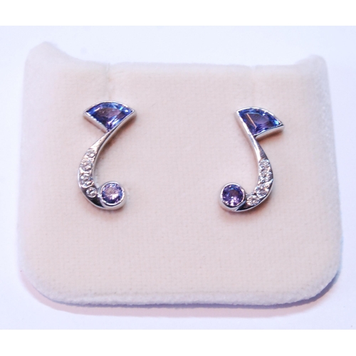 115 - Pair of tanzanite and diamond earrings of comma shape, in 18ct white gold, 4g.