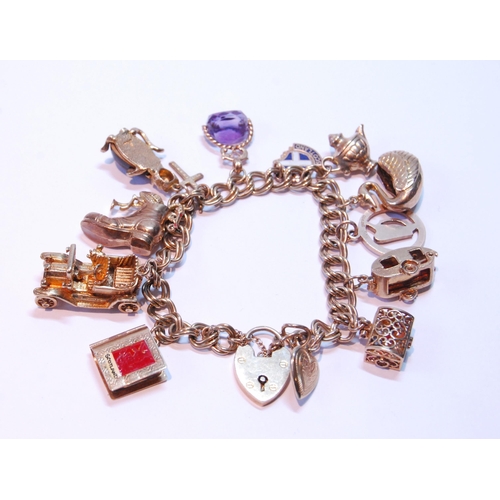 117 - Gold bracelet with 9ct and other charms dependant, 50g gross.