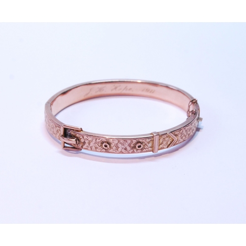 118 - 9ct gold hinged buckle bangle, half engraved, 1911, 10g.