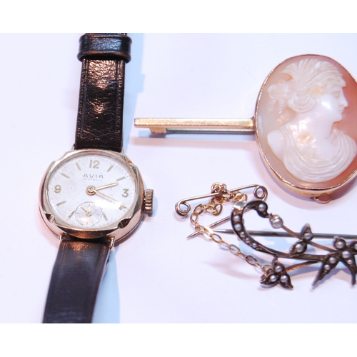 122 - Two ladies' gold watches, a cameo pin, locket and a pearl openwork brooch.  (5)