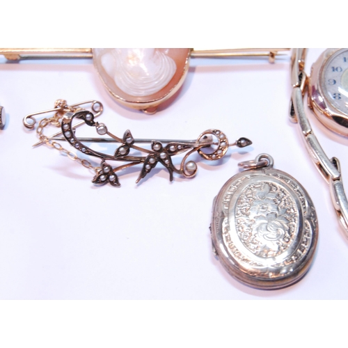 122 - Two ladies' gold watches, a cameo pin, locket and a pearl openwork brooch.  (5)