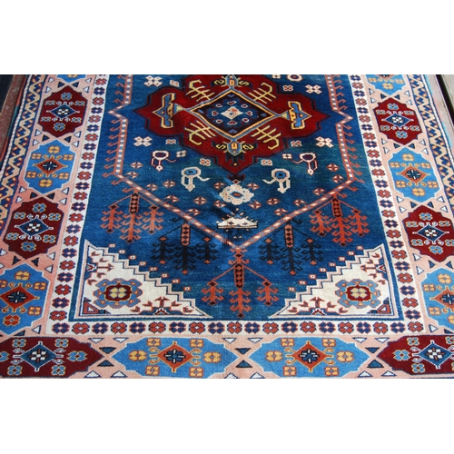 362 - Turkish rug decorated with a large geometric medallion to the centre, guls and further geometric mot... 