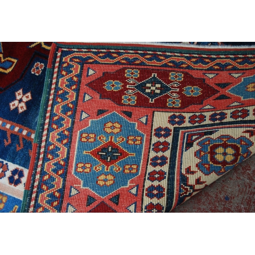 362 - Turkish rug decorated with a large geometric medallion to the centre, guls and further geometric mot... 