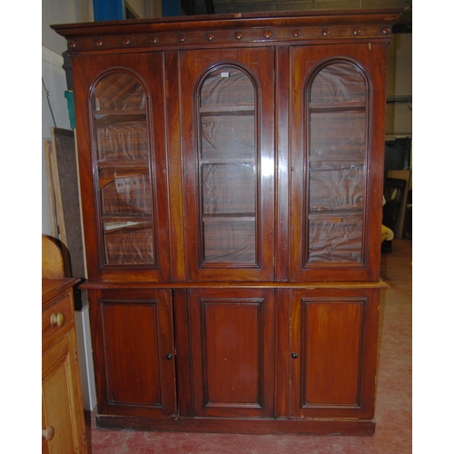 409 - Victorian mahogany library bookcase with Gothic-influenced roundels to the shaped cornice above thre... 