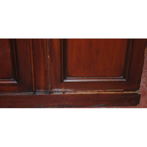 409 - Victorian mahogany library bookcase with Gothic-influenced roundels to the shaped cornice above thre... 