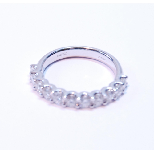 90 - Diamond half eternity ring with eleven brilliants, each approximately .10ct, in platinum, size M.