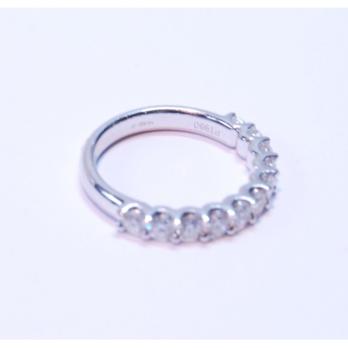 90 - Diamond half eternity ring with eleven brilliants, each approximately .10ct, in platinum, size M.