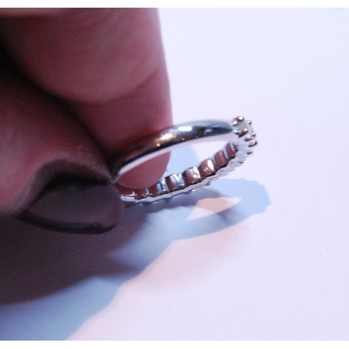 90 - Diamond half eternity ring with eleven brilliants, each approximately .10ct, in platinum, size M.