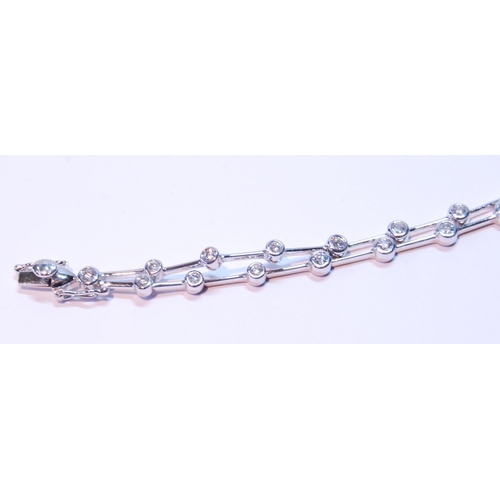 93 - Bracelet with a double row of diamond brilliants, collet-set, thirty-six in all, in 18ct white gold.