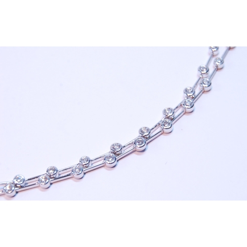 93 - Bracelet with a double row of diamond brilliants, collet-set, thirty-six in all, in 18ct white gold.