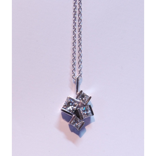 94 - Pendant with four randomly-set rectangular diamond brilliants, in 18ct white gold.