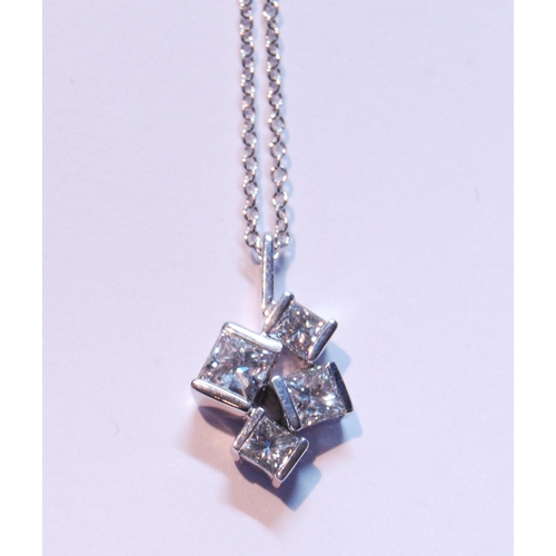 94 - Pendant with four randomly-set rectangular diamond brilliants, in 18ct white gold.