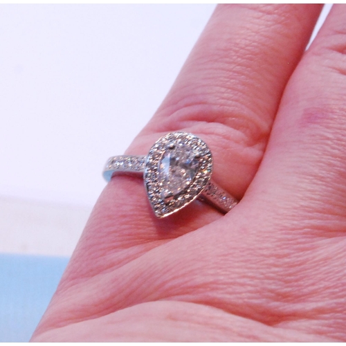 97 - Diamond pear-shaped cluster ring with brilliant, the border and shoulders set with tiny brilliants, ... 