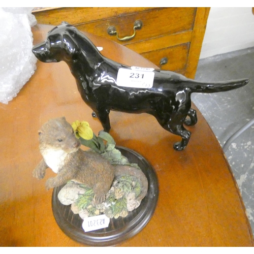 231 - Beswick figure of a Labrador and a Royal Doulton figure of an otter. (2).