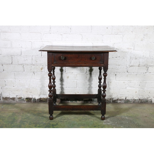 473 - An 18th century oak side table, the top with moulded edge over frieze drawer with later handles, rai... 