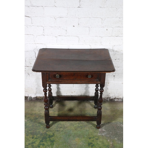 473 - An 18th century oak side table, the top with moulded edge over frieze drawer with later handles, rai... 