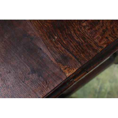 473 - An 18th century oak side table, the top with moulded edge over frieze drawer with later handles, rai... 