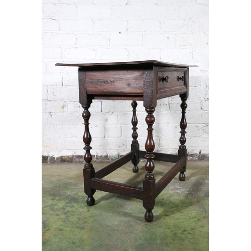 473 - An 18th century oak side table, the top with moulded edge over frieze drawer with later handles, rai... 