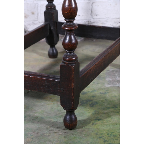 473 - An 18th century oak side table, the top with moulded edge over frieze drawer with later handles, rai... 