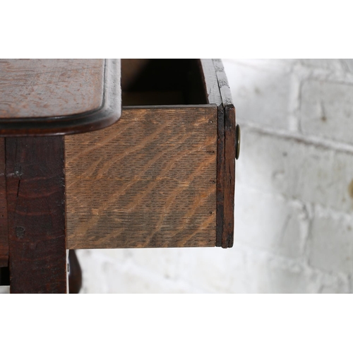 473 - An 18th century oak side table, the top with moulded edge over frieze drawer with later handles, rai... 