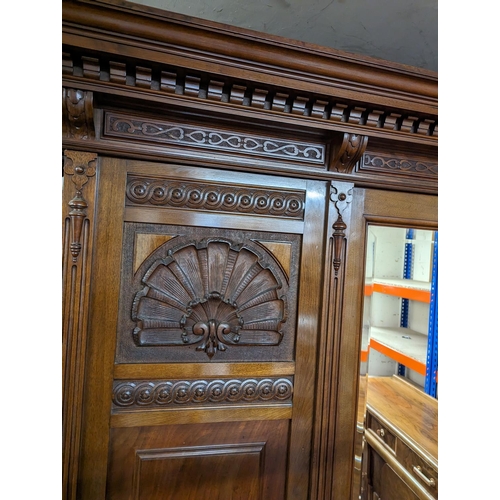 477 - John Taylor & Son of Edinburgh three door wardrobe, with moulded and dentil cornice over shell a... 