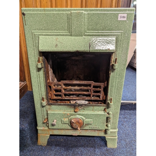 479 - Green finished cast metal stove 'Vesper?', 72cm tall.