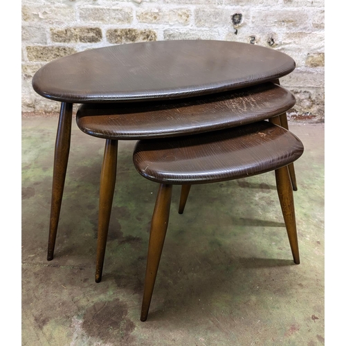 482 - Set of three Ercol dark elm top pebble nesting tables, largest measures 40cm high.