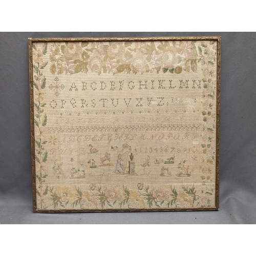 243 - Antique needlework alphabet sampler with floral border enclosing multiple alphabets and numerical st... 