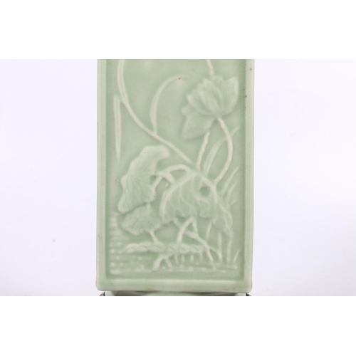 394 - Chinese celadon porcelain vase of square section, decorated with relief floral designs, reign seal m... 