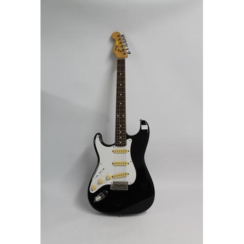 244 - Fender Stratocaster left handed re issue from 1988/89, model number H034064 in black and white.