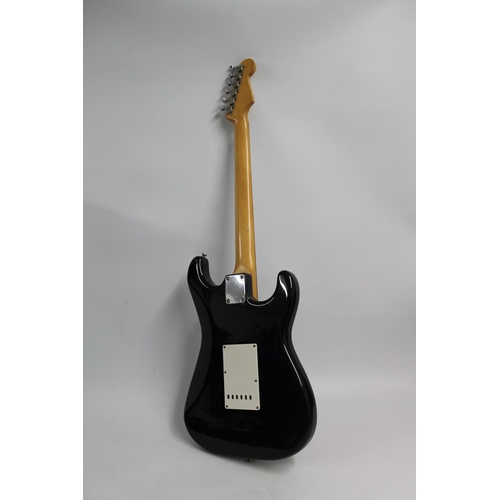 244 - Fender Stratocaster left handed re issue from 1988/89, model number H034064 in black and white.