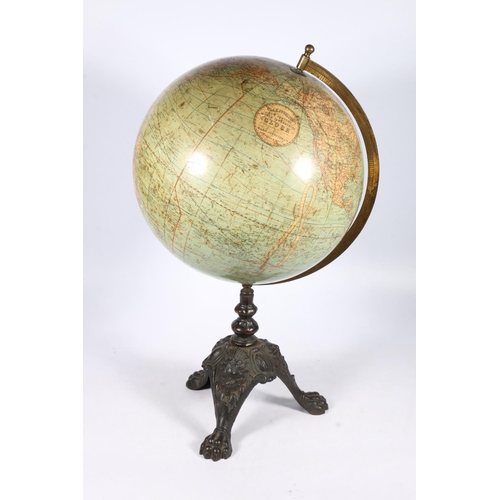 271 - W and A K Johnston of Edinburgh New Century 12 inch terrestrial globe raised on cast iron tripod bas... 