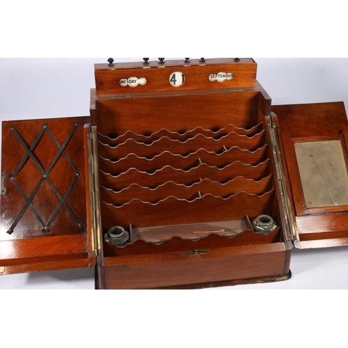 279 - Victorian mahogany slope-fronted stationary box, the top with day-date-month calendar, two doors ope... 