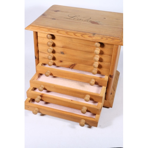 282 - 20th century pine nine-drawer specimen chest raised on plinth base with block feet, 38cm wide.