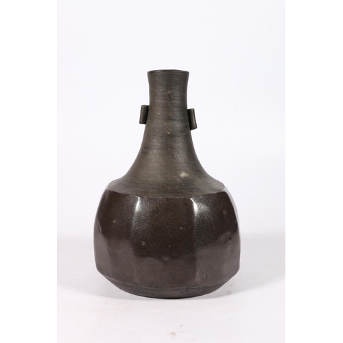 300 - Janet Leach (1918-1997) for St Ives Pottery, a studio pottery cut sided bottle vase, 23cm tall.