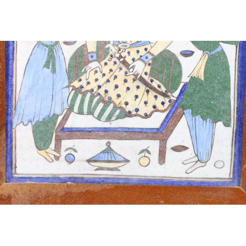 306 - Large Iznik Persian painted pottery tile depicting a king? with Mameluke sword sat with two attendan... 